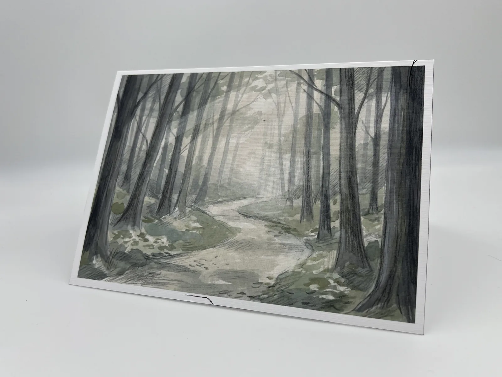 A sympathy card depicting a quiet path winding through a misty forest